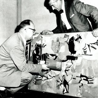 Artist Russell Drysdale and Laurie Thomas, Director, Queensland Art Gallery, assessing entries in the 1961 HC Richards Prize, Queensland Art Gallery / Collection: QAGOMA Research Library / Image courtesy: The Courier Mail