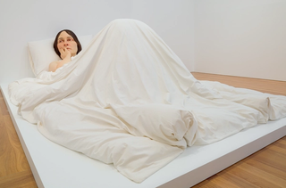 Ron Mueck, England b.1958 / Installation view of In bed 2005 / Mixed media / 161.9 x 649.9 x 395cm / Purchased 2008. Queensland Art Gallery Foundation / Collection: Queensland Art Gallery | Gallery of Modern Art / © Ron Mueck