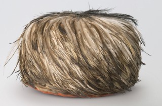Shirley Macnamara, Indjalandji/Alyawarr, Australia b.1949 / Skullcap 2013 / Spinifex (Triodia pungens), red ochre, emu feathers, spinifex resin and synthetic polymer fixative / 14 x 21cm (diam.) / Purchased 2014 with funds from Gina Fairfax through the Queensland Art Gallery | Gallery of Modern Art Foundation / Collection: Queensland Art Gallery | Gallery of Modern Art / © Shirley Macnamara